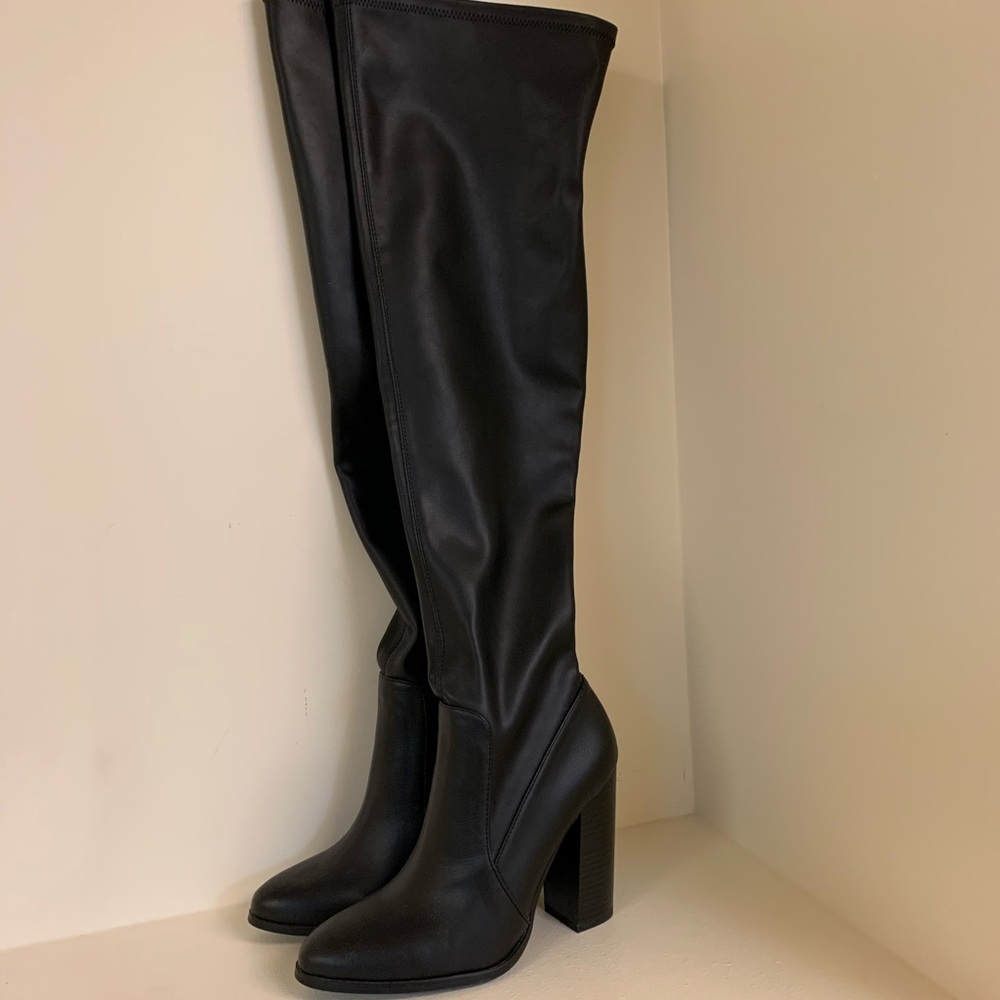 Thigh high heeled boots